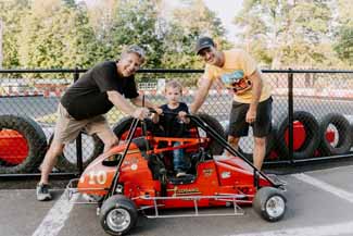 Three generations of Loganos with the original go kart that was gifted to young Joey.
